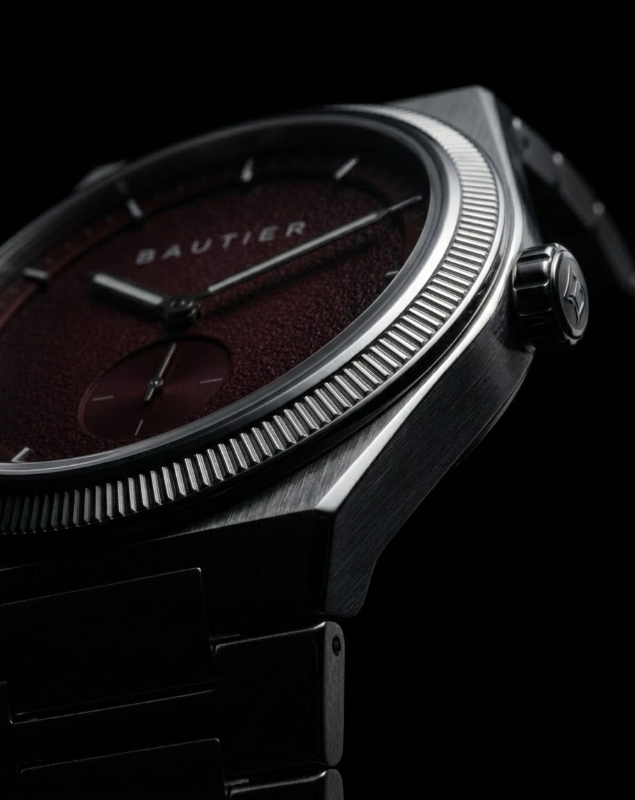 Close-up of the Bautier Formstudie I watch, with a burgundy dial and brushed steel case